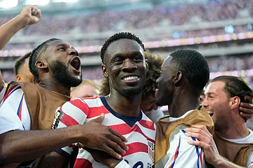 AP Photo/Andre Penner : United States' Folarin Balogun, center, celebrates scoring his side's third goal against Paraguay with teammates during the World Cup Group D soccer match in Inglewood, Calif., near Los Angeles, Friday, June 12, 2026.