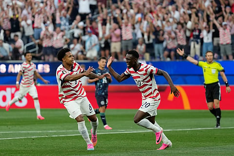 United States' Folarin Balogun (20) celebrates scoring his side's second goal against Paraguay during the World Cup Group D soccer match in Inglewood, Calif., near Los Angeles, Friday, June 12, 2026.
