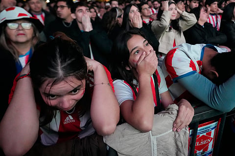 Paraguay fans react while watching the World Cup Group D soccer match between the United States and Paraguay in Asuncion, Paraguay Friday, June 12, 2026.