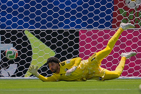 Qatar goalkeeper Mahmoud Abunada makes a save during their FIFA World Cup 2026, Group B match against Switzerland in Santa Clara, Calif., near San Francisco, Saturday, June 13, 2026.