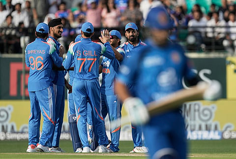 India's Arshdeep Singh, second left, celebrates the wicket of Afghanistan's Rahmat Shah, leaves the ground after losing his wicket during the first ODI cricket match between Afghanistan and India in Dharamshala.