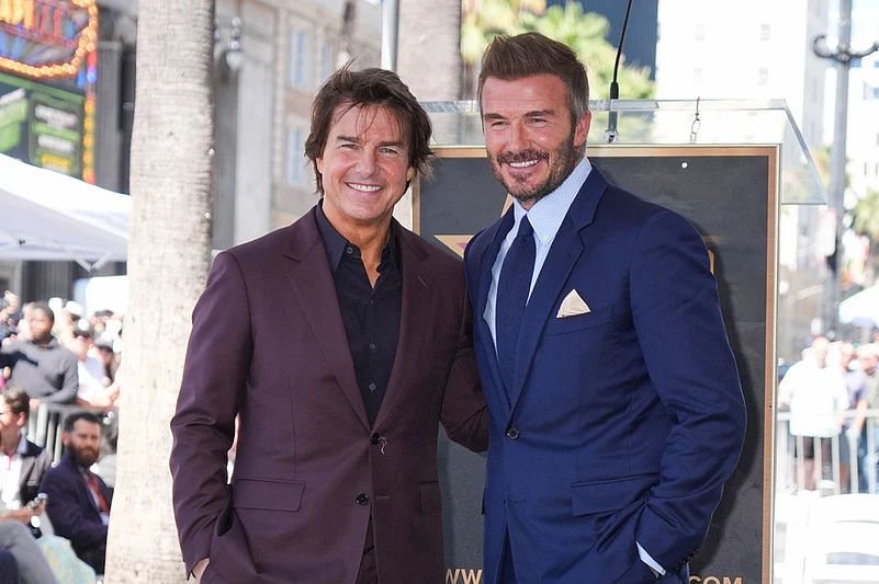 Tom Cruise and David Beckham pose with Beckhams star at the Hollywood Walk of Fame