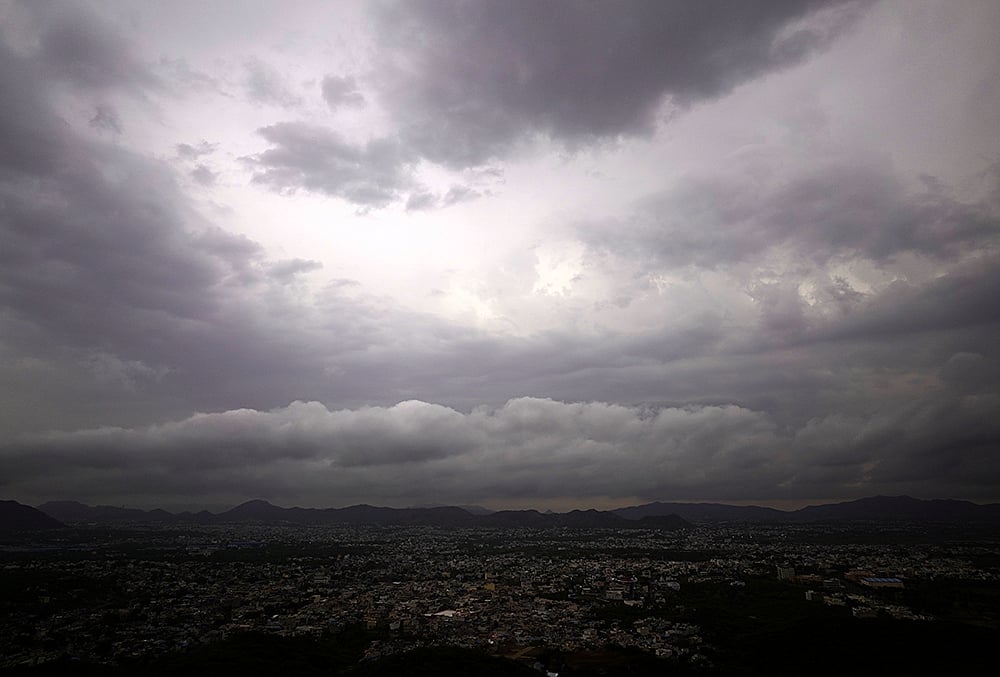 Dark clouds hover over the city during the pre-monsoon season, in Ajmer, Rajasthan. - | Photo: PTI