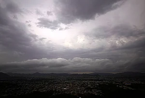 | Photo: PTI : Dark clouds hover over the city during the pre-monsoon season, in Ajmer, Rajasthan.