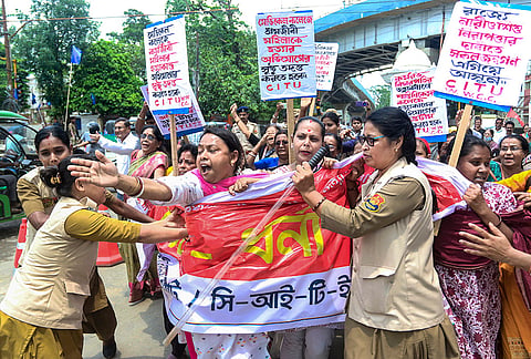 Centre of Indian Trade Unions (CITU) supporters being detained during a protest over the alleged murder of a woman employee at Santiniketan Medical College, in Agartala, Tripura.