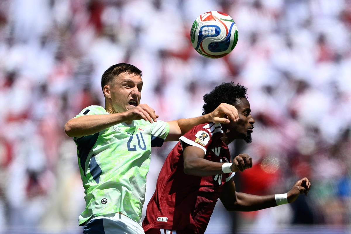 Switzerland's Michel Aebischer, left, fights for the ball under pressure from Qatar's Yusuf Abdurisag, during their FIFA World Cup 2026, Group B match in Santa Clara, Calif., near San Francisco, Saturday, June 13, 2026. - AP Photo/Eakin Howard