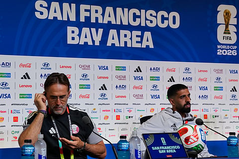 Qatar head Coach Julen Lopetegui, left, and Qatar player Hassan Al-Haydos, right attend a press conference Friday, June 12, 2026, at San Francisco Bay Area Stadium in Santa Clara, Calif., near San Francisco, ahead of the World Cup Group B soccer match between Qatar and Switzerland.