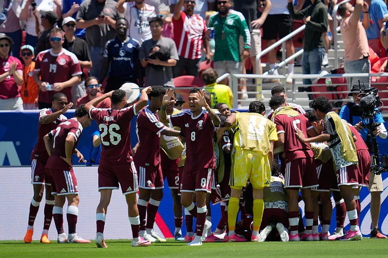 Qatar players celebrate after scoring during the World Cup Group B soccer match between Qatar and Switzerland in Santa Clara, Calif., near San Francisco, Saturday, June 13, 2026. - AP Photo/Eugene Hoshiko