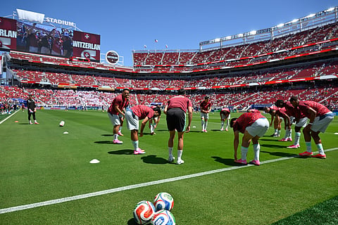 Members of the Swiss team warm up ahead of the start of the World Cup Group B soccer match between Qatar and Switzerland in Santa Clara, Calif., near San Francisco, Saturday, June 13, 2026.
