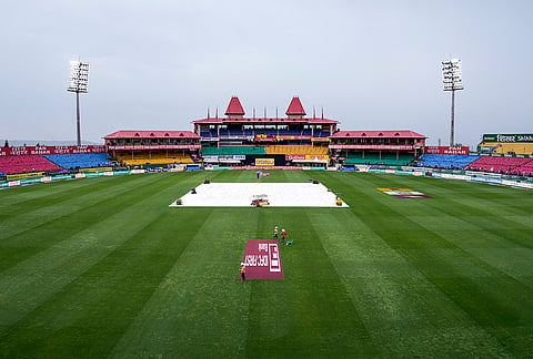 Covered pitch is seen amid rainfall ahead of an ODI cricket match between India and Afghanistan, in Dharamshala, Himachal Pradesh.