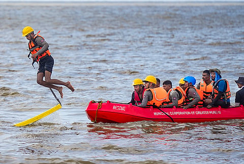 Mumbai Fire Brigade personnel conduct flood rescue and beach safety drills at Girgaon Chowpatty ahead of the monsoon season, in Mumbai, Maharashtra.
