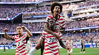 (AP Photo/Andre Penner) : United States' Folarin Balogun (20) celebrates scoring his side's third goal against Paraguay with teamates during the World Cup Group D soccer match in Inglewood, Calif., near Los Angeles, Friday, June 12, 2026