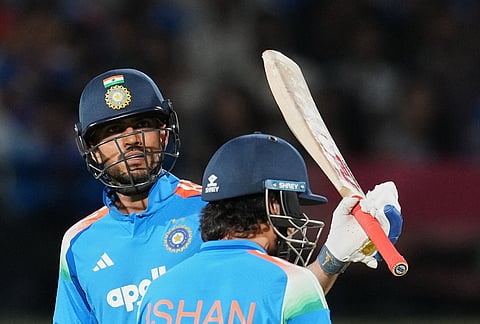 India's captain Shubman Gill, left, celebrates his fifty runs during the first ODI cricket match between Afghanistan and India in Dharamshala.