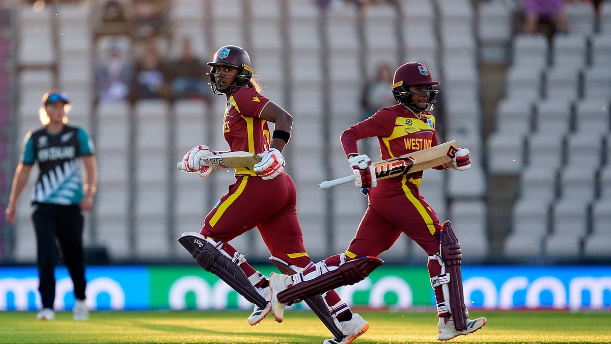 West Indies' Hayley Matthews, left, and Shemaine Campbelle run between the wickets during the Women's T20 World Cup match between New Zealand and West Indies in Southampton, England, Saturday June 13, 2026.  - (Andrew Matthews/PA via AP)