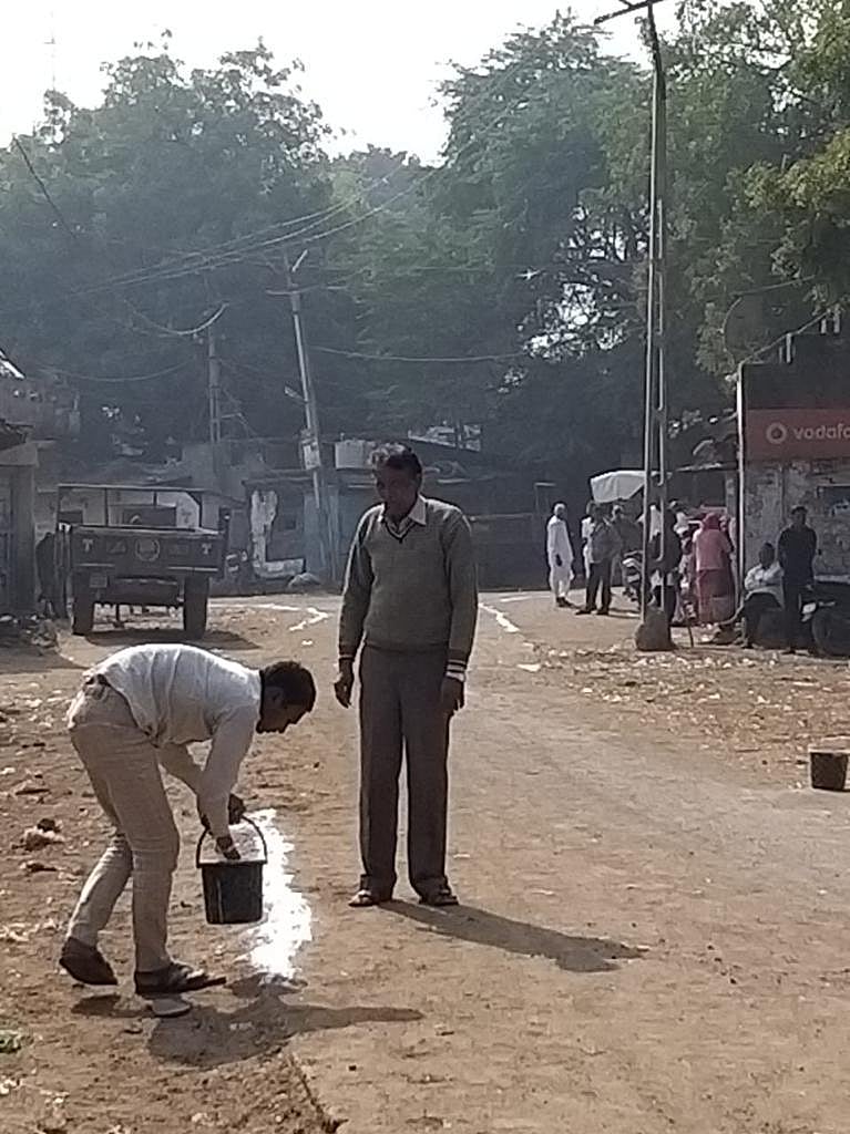 a worker marking roads