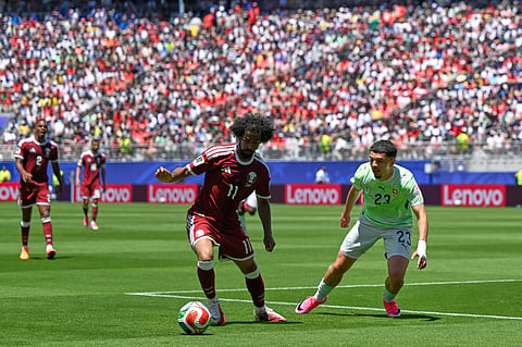 Qatar's Akram Afif attempts to get past Switzerland's Zeki Amdouni during the World Cup Group B soccer match between Qatar and Switzerland in Santa Clara, Calif., near San Francisco, Saturday, June 13, 2026.