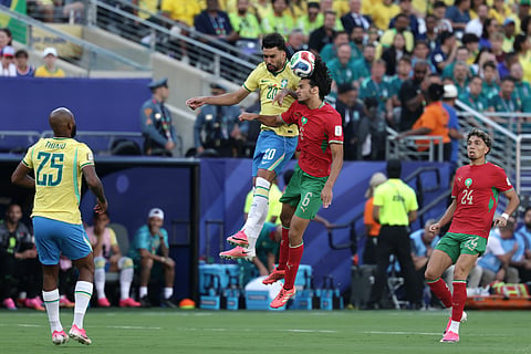 Morocco's Ayyoub Bouaddi (6) heads the ball against Brazil's Lucas Paqueta (20) in the first half during the World Cup Group C soccer match between Brazil and Morocco in East Rutherford, N.J., near New York, Saturday, June 13, 2026.