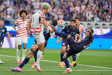 United States' Antonee Robinson and Paraguay's Mauricio, right, battle for the ball during the World Cup Group D soccer match between the United States and Paraguay in Inglewood, Calif., near Los Angeles, Friday, June 12, 2026.