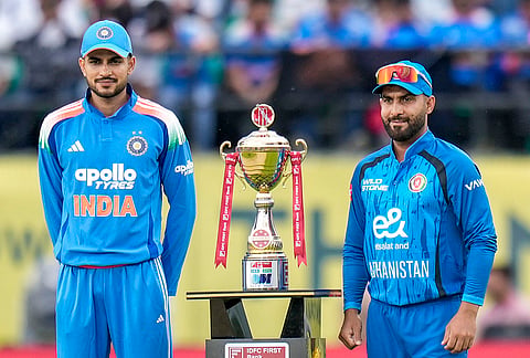 India's captain Shubman Gill, left, and Afghanistan's captain Hashmatullah Shahidi during the toss before an ODI cricket match between India and Afghanistan, in Dharamshala, Himachal Pradesh.