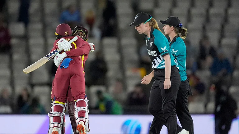 West Indies' Shemaine Campbelle, left, and Jahzara Claxton celebrate after hitting the winning runs after the Women's T20 World Cup match between New Zealand and West Indies in Southampton, England, Saturday June 13, 2026. - (Andrew Matthews/PA via AP)