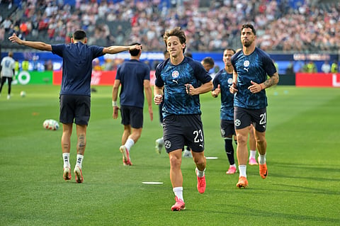 Members of team Paraguay, including Matias Galarza (23) and Gabriel Avalos (21) warm up before the start of their FIFA World Cup 2026, Group D match against the United States in Inglewood, Calif., near Los Angeles, Friday, June 12, 2026.