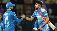 (AP Photo/Ashwini Bhatia) : Afghanistan's Ibrahim Zadran, congratulates India's captain Shubman Gill after winning the first ODI cricket match in Dharamshala, India, Saturday, June 13, 2026.