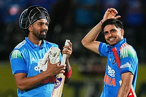 | Photo: AP/Ashwini Bhatia : India's captain Shubman Gill, right, KL Rahul celebrate their victory during the first ODI cricket match between Afghanistan and India in Dharamshala.