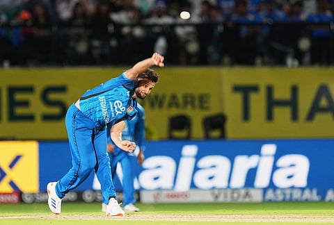 Afghanistan's Azmatullah Omarzai bowls a delivery during the first ODI cricket match between Afghanistan and India in Dharamshala.