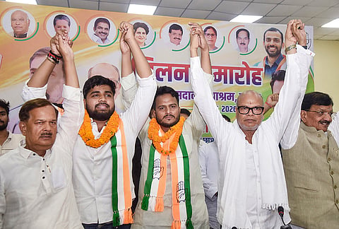 Bihar Congress President Rajesh Ram, second right, with former Patna University Students Union President Manish Yadav, centre, and others as he joins the party, at Sadaqat Ashram, in Patna, Bihar.