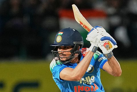 India's captain Shubman Gill hits a four during the first ODI cricket match between Afghanistan and India in Dharamshala.