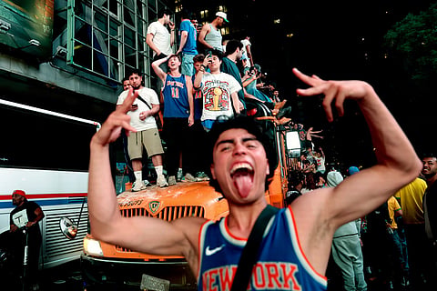 New York Knicks fans celebrate their victory after Game 5 of the NBA Finals basketball series against the San Antonio Spurs in New York.