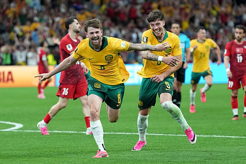 Australia's Connor Metcalfe (8) celebrates with Australia's Jordan Bos (5) after scoring their second goal during the World Cup Group D soccer match between Australia and Turkey in Vancouver, British Columbia, Saturday, June 13, 2026.