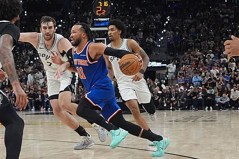 New York Knicks guard Jalen Brunson (11) drives as San Antonio Spurs center Luke Kornet (7) defends during the second half of Game 5 of the NBA Finals basketball series in San Antonio.