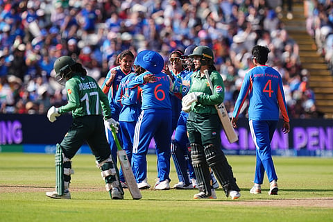 India's Deepti Sharma celebrates with teammates after running out Pakistan's Muneeba Ali during the ICC Women's T20 World Cup, Group 1 cricket match between India and Pakistan in Birmingham, England.