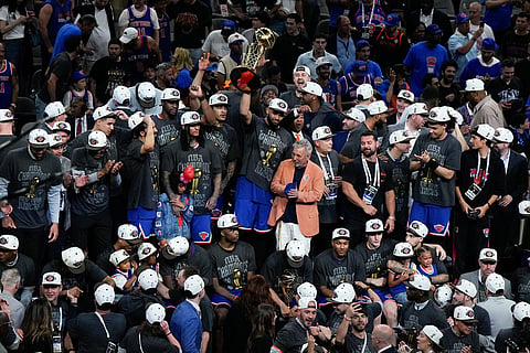 The New York Knicks pose for photographers with the Larry O'Brien Championship Trophy after defeating the San Antonio Spurs in Game 5 of the NBA Finals basketball series in San Antonio.