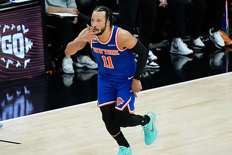 New York Knicks guard Jalen Brunson motions after a basket against the San Antonio Spurs during the first half of Game 5 of the NBA Finals basketball series in San Antonio.