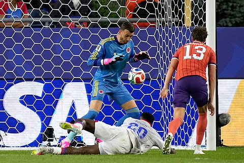 Scotland goalkeeper Angus Gunn (1) blocks a shot against Haiti's Frantzdy Pierrot (20) during the World Cup Group C soccer match between Haiti and Scotland in Foxborough, Mass., near Boston, Saturday, June 13, 2026.