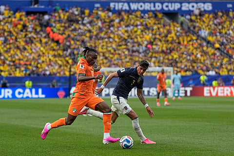 Ivory Coast's Yan Diomande, left, and Ecuador's Piero Hincapie vie for the ball during a World Cup Group E soccer match in Philadelphia, Sunday, June 14, 2026.