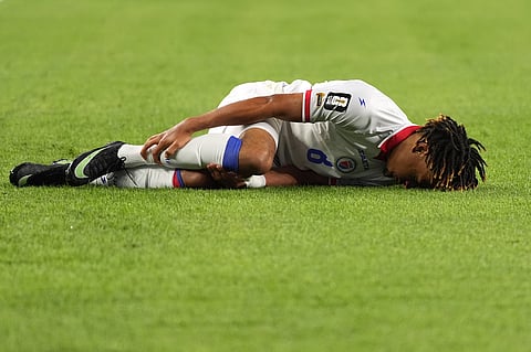 Haiti's Martin Experience (8) reacts to being injured during the World Cup Group C soccer match between Haiti and Scotland in Foxborough, Mass., near Boston, Saturday, June 13, 2026.