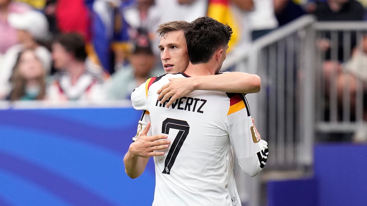 Germany's Kai Havertz celebrates with teammate Nico Schlotterbeck, left, after scoring his side's third goal during the World Cup Group E soccer match between Germany and Curacao in Houston, Sunday, June 14, 2026. - (AP Photo/Karen Warren)