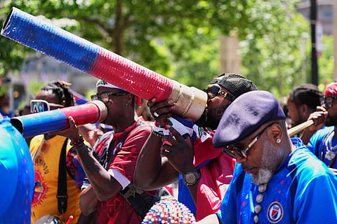 Haiti supporters march on a street in central Boston, Mass,, ahead of the World Cup Group C soccer match between Haiti and Scotland in Foxborough, Saturday, June 13, 2026.