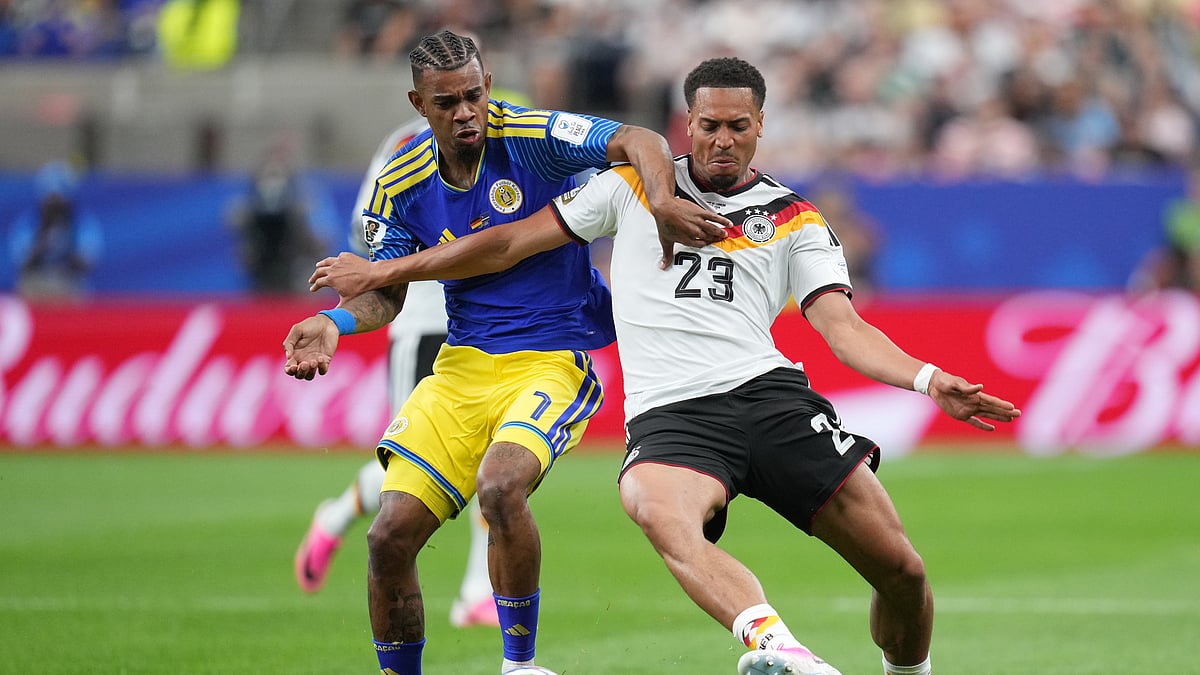 Curaçao's Juninho Bacuna, left, and Germany's Felix Nmecha fight for the ball during the World Cup Group E soccer match between Germany and Curacao in Houston, Sunday, June 14, 2026.  - (AP Photo/Eric Gay)