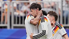 Germany's Kai Havertz celebrates with teammate Jonathan Tah, left, after scoring his side's third goal during the World Cup Group E soccer match between Germany and Curacao in Houston, Sunday, June 14, 2026. - (AP Photo/Karen Warren)