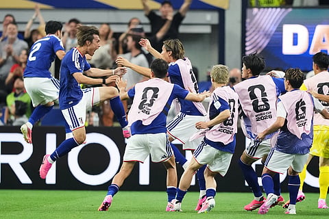Japan's Koki Ogawa, left, celebrates with teammates their side's second goal against the Netherlands during a World Cup Group F soccer match in Arlington, Texas, near Dallas, Sunday, June 14, 2026.