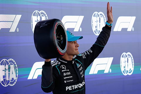 Mercedes driver George Russell of Britain celebrates his pole position after qualifying session for the Spain F1 Grand Prix at the Barcelona Catalunya racetrack in Montmelo, near Barcelona, Spain.