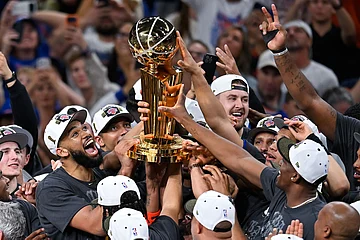 | Photo: AP/Darren Abate : The New York Knicks celebrate with the Larry O'Brien Championship Trophy after defeating the San Antonio Spurs in Game 5 of the NBA Finals basketball series in San Antonio.
