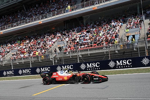 Ferrari driver Lewis Hamilton of Britain steers his car during qualifying session for the Spain F1 Grand Prix at the Barcelona Catalunya racetrack in Montmelo, near Barcelona, Spain.