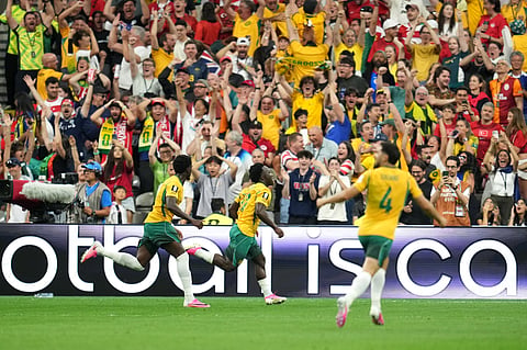 Australia's Nestory Irankunda, center, celebrates after scoring their opening goal during the World Cup Group D soccer match between Australia and Turkey in Vancouver, British Columbia, Saturday, June 13, 2026.