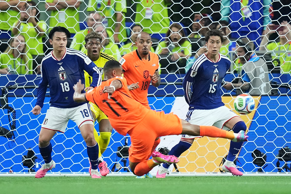 Netherlands' Cody Gakpo (11) kicks the ball during a World Cup Group F soccer match against Japan in Arlington, Texas, near Dallas, Sunday, June 14, 2026. - AP Photo/Julio Cortez