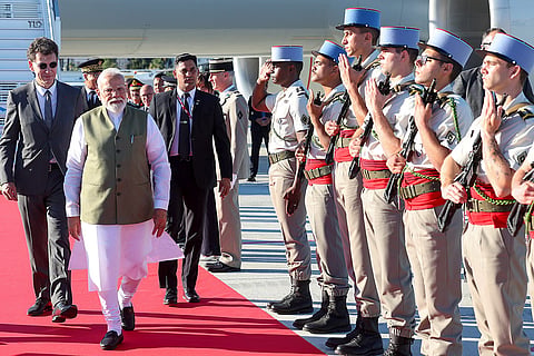 In this image released on June 13, 2026, Prime Minister Narendra Modi being accorded a Guard of Honour as he is received by France's Minister of Higher Education, Research and Space Philippe Baptiste upon his arrival at the Nice Cote d'Azur Airport, in Nice, France.